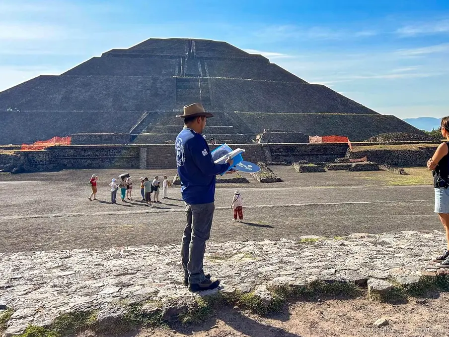 Small group on a Teotihuacan guided tour walking the Avenue of the Dead